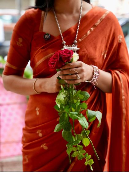 A close-up of our best-selling rust orange jute linen saree, a piece that has received over 150 pre-booking orders.