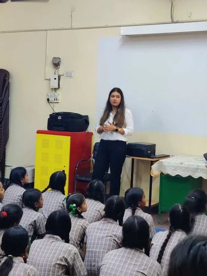 Addressing a classroom of students, sharing my journey and encouraging them to consider the field of law.