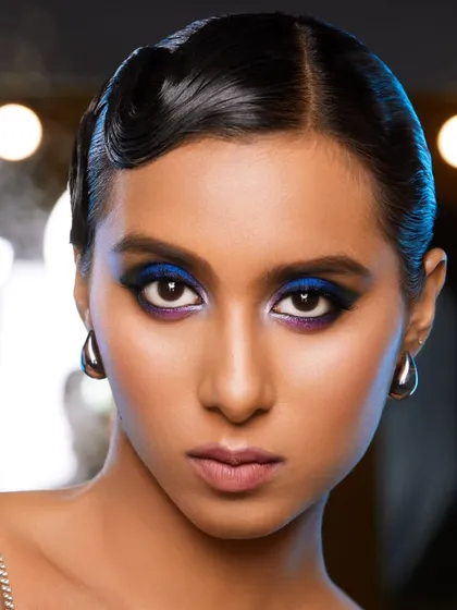 For this high-fashion concept, I created a vibrant cobalt blue smokey eye, paired with vintage-inspired finger waves. This demonstrates my skill in executing bold, colorful makeup for editorial and magazine shoots where making a statement is key.