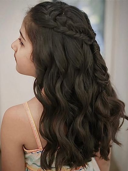 A side view of the braided half-updo, showcasing how the style elegantly frames the face while keeping hair neatly styled.