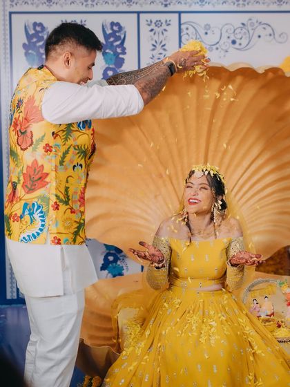 A fun moment during the Haldi ceremony as cricketer Surya Kumar Yadav showers his sister, the bride, with flower petals.