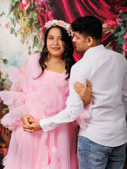 Capturing the partnership and shared excitement of expecting a child. This pose shows the couple holding hands and looking towards their future together. It’s a beautiful way to document the beginning of your story as a family.
