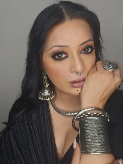 Another angle showcasing the stacked silver bangles and oversized ring. When accessorizing, don't be afraid to go bold.