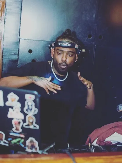 Moving in motion. A candid shot of me feeling the beat while I'm mixing.