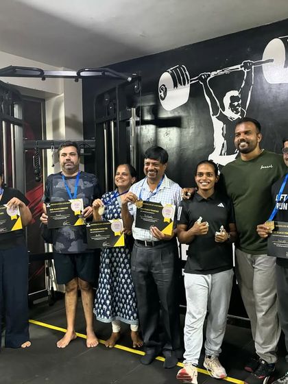 A group of our members, both men and women, celebrating their achievements.
