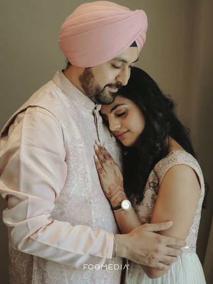 A quiet, heartfelt embrace between a couple in elegant traditional wear. This photo captures a moment of peace and deep affection.
