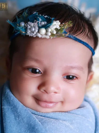 An absolutely precious smiling, awake portrait from our blue-themed session. Capturing these moments is what we live for.