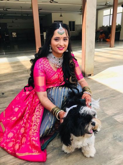 A lovely moment with her furry friend. I ensure the makeup is set perfectly to last through all the happy and candid moments of the day.