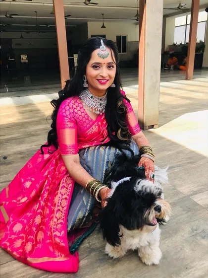 The bond between a bride and her pet is always so special to witness. She looks radiant and happy.