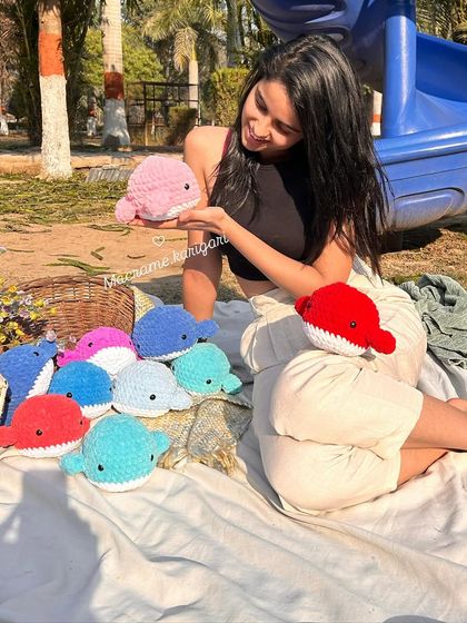 Having some fun at the park with our collection of handmade crochet whales. Their soft texture and bright colors make them a favorite among kids.