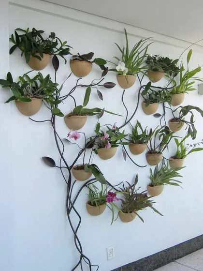 For clients who want something truly unique, I love designing living art. This is an orchid tree we created, using a custom metal frame to display a variety of beautiful orchids on a vertical surface, turning a simple wall into a botanical masterpiece.