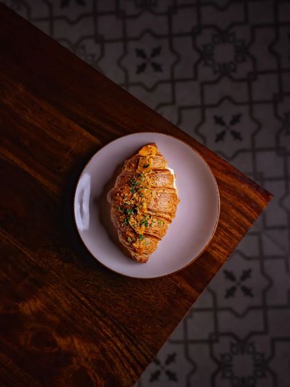 Excess is not always bad, especially when it comes to our Garlic and Cheese Croissant, a flaky, buttery roll bursting with herby, garlicky flavor.