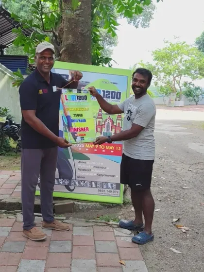 A finisher receives his award for the Tea Garden & Cape Comorin 1200K LRM. This ride, organized by Cochin Bikers Club, features extreme heat and continuous rolling terrain.