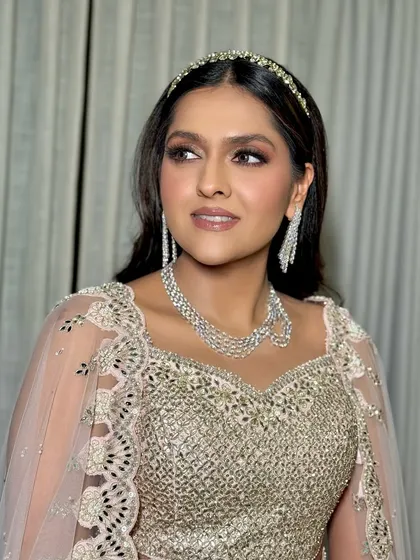 A side profile that highlights the beautiful contour and highlight on her cheekbones.