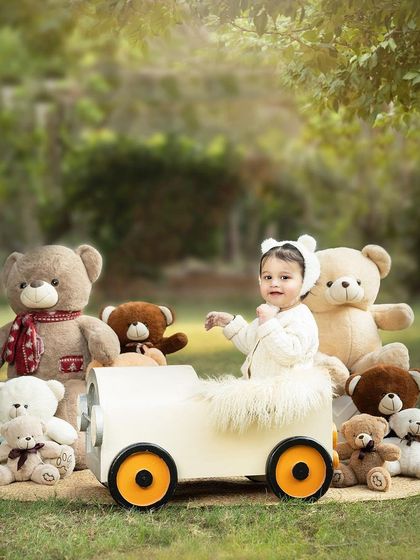 A teddy bear's picnic in the park. This outdoor setup is perfect for a classic and sweet-themed photoshoot with lots of furry friends.