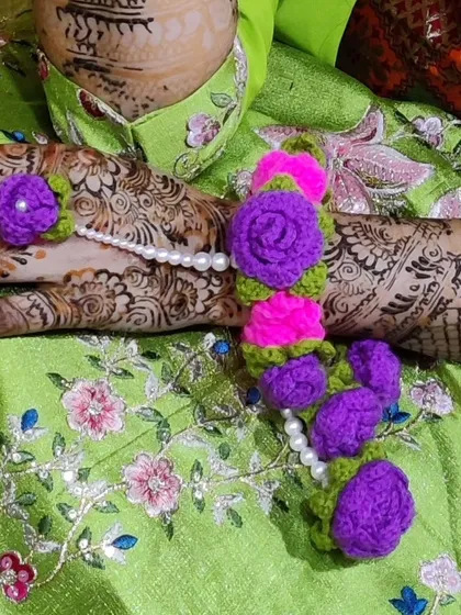 A complete floral crochet jewelry set I created for a bride's mehndi ceremony. The vibrant purple and pink flowers are paired with pearls to create a stunning and unique look.