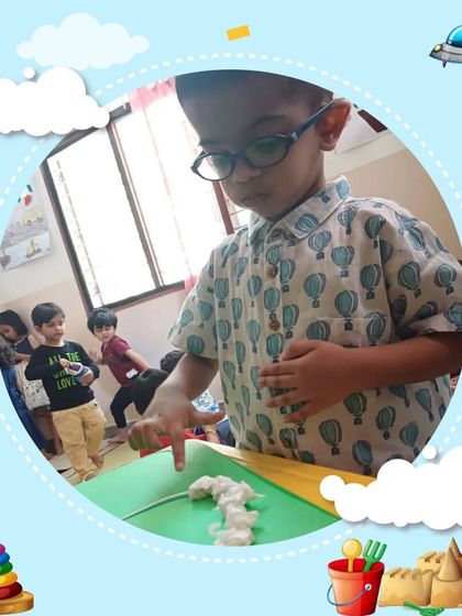 This image captures a moment of concentration and discovery during a phonics session. We love seeing children's imaginations soar as they learn about sounds and words.