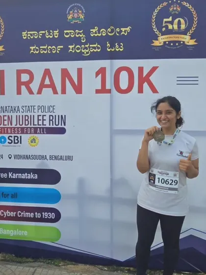 A happy runner from our team after completing the Golden Jubilee 10K.