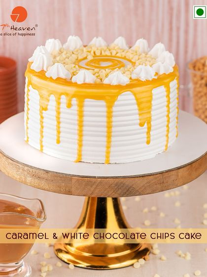 Sweet, salty, and sophisticated. This Caramel & White Chocolate Chips Cake is a delight, with a sweet caramel drip over white frosting, finished with crunchy white chocolate chips.