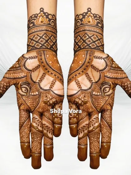 A clean, symmetrical shot of a traditional design against a white background, emphasizing the precision of the artwork.