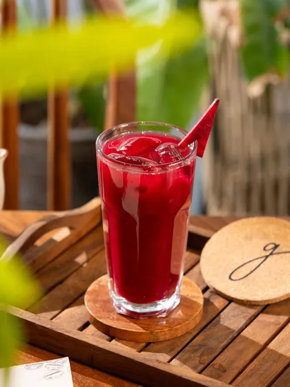A deep red beetroot juice. The rich, earthy color is the star, shot simply to highlight the natural ingredient.