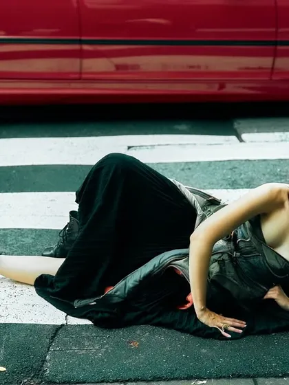 We stopped traffic in Tokyo for this shot. Placing the model on a zebra crossing with a bold red car in the frame creates a story of urban defiance. It’s about finding those unexpected frames and pushing the boundaries to get an image that stands out.