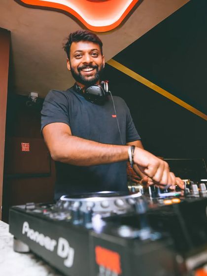 Be happy with what you have while working for what you want. A smiling shot from behind the console.