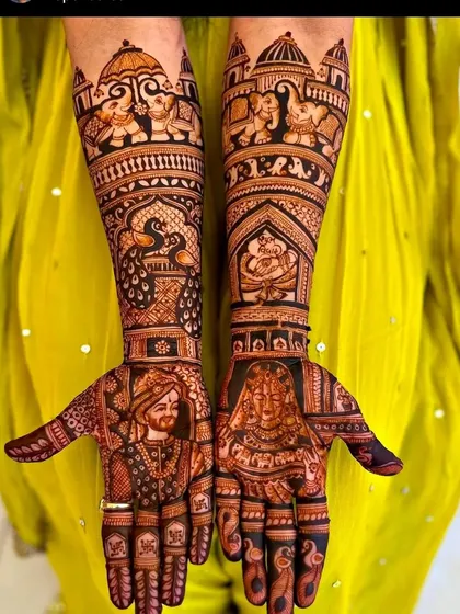 A full bridal design featuring lifelike portraits of the bride and groom. Notice the intricate details in the clothing and the traditional Rajasthani elements like elephants and palaces on the arms.