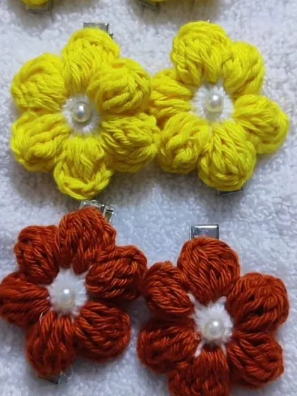 Colorful floral tic-tac clips with pearl centers. The yellow and orange flowers are so bright and cheerful.