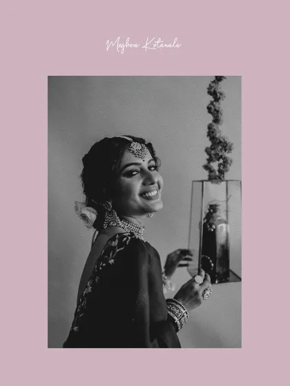 A happy moment captured during a bridal shoot. This black and white image, framed with a soft pink border, feels both classic and modern. The bride's smile is the most beautiful accessory.