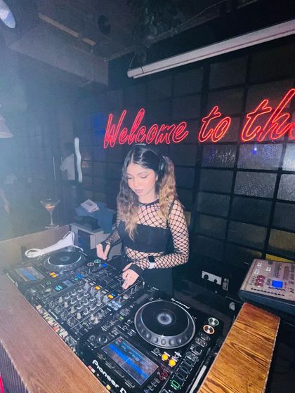 A shot from the DJ booth, showing my Pioneer setup and the club's ambiance.