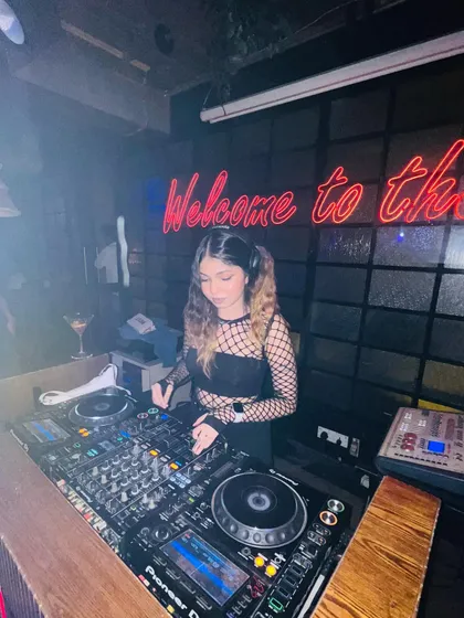 A shot from the DJ booth, showing my Pioneer setup and the club's ambiance.