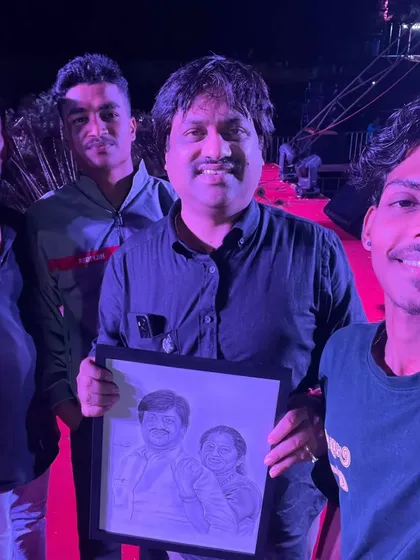 Another photo from the event, capturing the moment of presenting the artwork.
