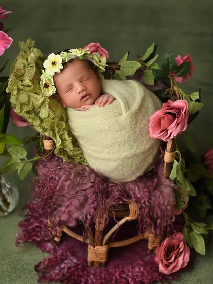 For this floral-themed newborn shot, I created a beautiful nest of flowers for the baby to rest in. The combination of fresh flowers and a peacefully sleeping baby makes for such a breathtaking and artistic portrait.