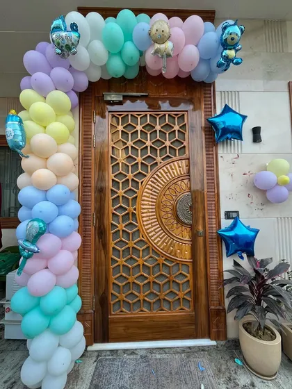 A beautiful pastel rainbow balloon arch to frame the main entrance. This creates an amazing first impression as you bring your baby home for the first time.
