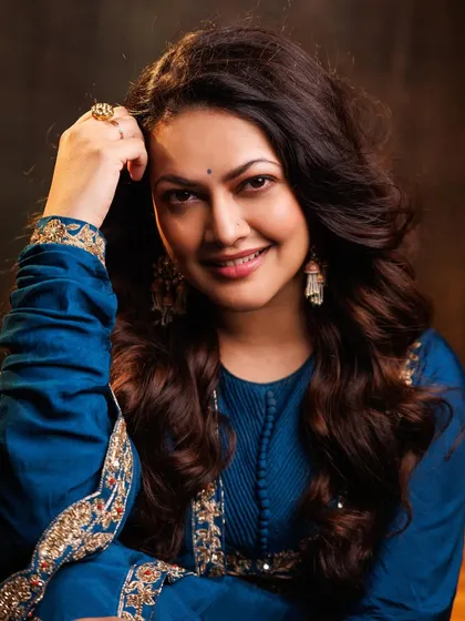 A lovely close-up portrait of Priyanka Barve, highlighting the beautiful earrings and the rich color of the Anarkali.