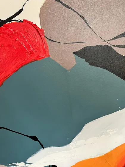 A detail shot showing the subtle textures and layers in the 'Colour Cluster' painting, where different colors and finishes meet.