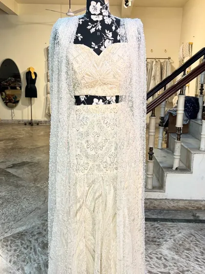 The full view of the 'APSARA' lehenga with the cape. It’s a stunning ensemble for a modern bride.