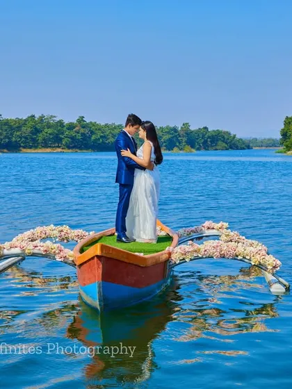 A romantic embrace in a beautifully decorated boat on the open water, creating a serene and picturesque pre-wedding portrait.
