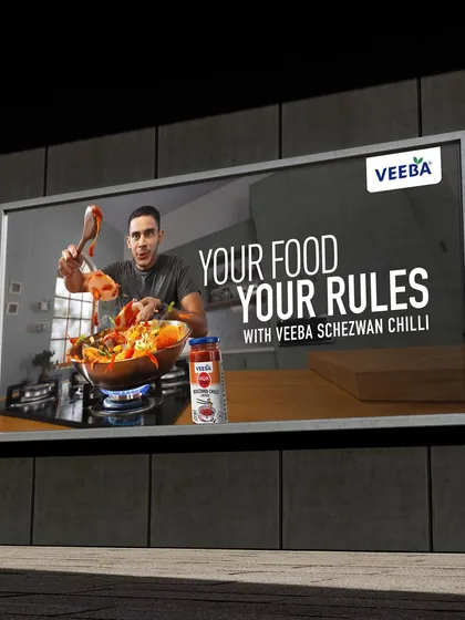 This image shows the Veeba Schezwan Chilli ad as a large format billboard. It highlights my experience in creating high resolution, impactful visuals suitable for large scale printing and outdoor advertising.