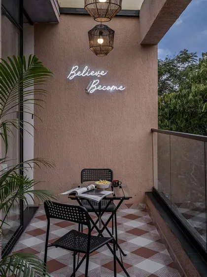This is one of my favorite spots in our office. The balcony serves as a small escape, with Chettinad-inspired floor tiles and a simple neon sign that acts as a daily reminder to believe and become. It’s a perfect spot for a quick chai break.