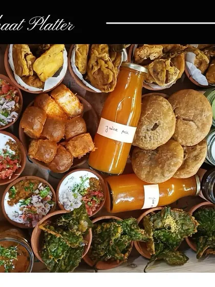 Another version of my popular Chaat Platter, this one features Kachori with Aloo ki Sabzi, Palak Ke Pakode, and Degi Mirch Kulcha, served with all the essential chutneys and dips.