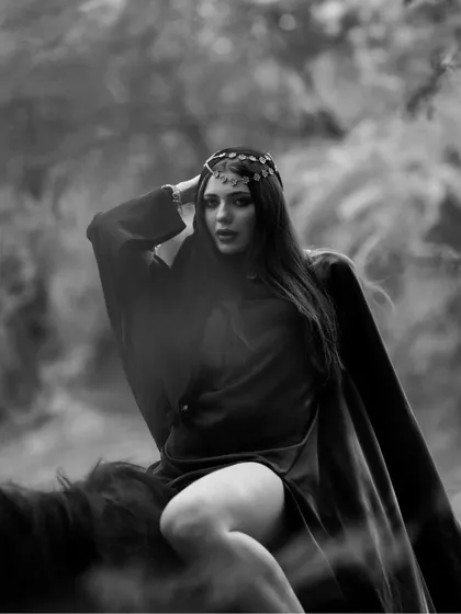 A dreamy, atmospheric black and white photo with a smoke effect, adding a layer of mystery and artistry to the equestrian shoot.