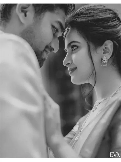 A timeless black and white close-up, capturing the intimate and loving gaze shared between the newly engaged couple.