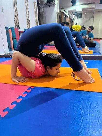 Purna Salabhasana, or the Full Locust Pose, is an intense backbend that requires great flexibility in the spine and shoulders. This student shows incredible openness.