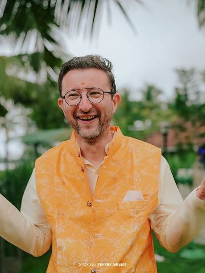 A guest's joyful and expressive reaction during the Haldi ceremony. These are the moments that add character and warmth to the wedding film.
