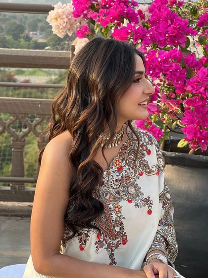 Another beautiful shot of the bride, her wavy hair catching the sunlight.