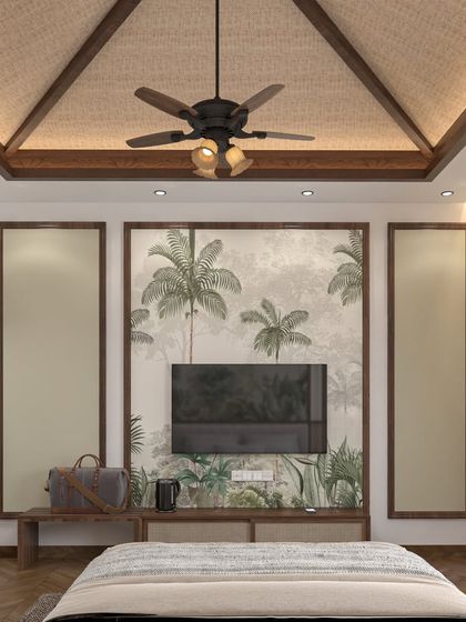 In this bedroom, the television is integrated into a feature wall with a nature-inspired mural. This design choice ensures that the technology doesn't dominate the room, maintaining a peaceful and uncluttered atmosphere.