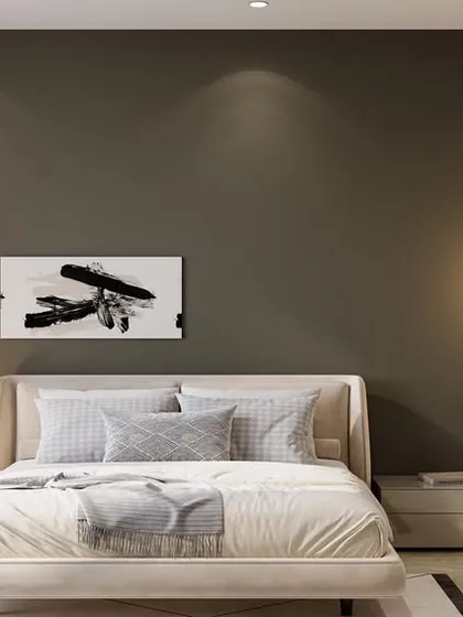 Here, minimalism is about creating a mood. A dark, olive-toned accent wall provides a dramatic backdrop for a simple upholstered bed and floating nightstands. The spherical lamps add a soft, sculptural touch.