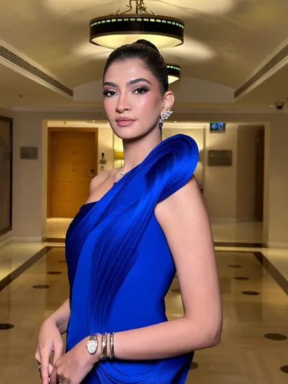 A close-up of the modern, soft glam makeup. The focus is on flawless skin and subtly defined features, creating a look that is both contemporary and timeless.